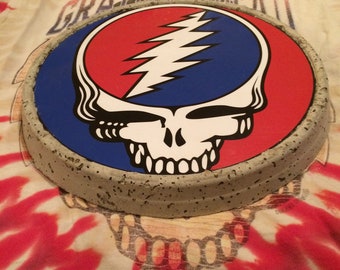 Your favorite bands logo on a garden stone (Grateful Dead - Steal your face shown here)