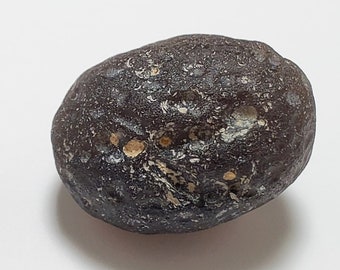 Colombianite from Valle Del Cauca, Colombia- 14.8 Grams- Sphere like Shape, Mineralized Pits and Grooves, Translucent- B23