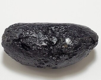Tektite from Thailand- 50.9 Grams- Thailandite, Indochinite- Slight Sheen, Divot, Oblong Oval, Chipped- TW18