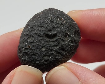 Saffordite 19.5 Grams- "Cintamani Stone" Safford Arizona USA- Palm Stone, Black Fine Texture Surface, Irregular Drop- Translucent- AE10