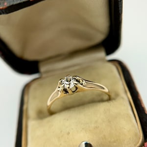 Antique claw-mounted diamond solitaire engagement ring in 14k yellow gold