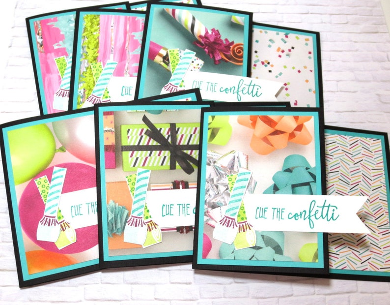May include: A collection of colorful greeting cards with a black border and a teal inner border. The cards feature birthday-themed designs, including balloons, confetti, gift boxes, and bows. The phrase "Cue the confetti" is written on a white banner.
