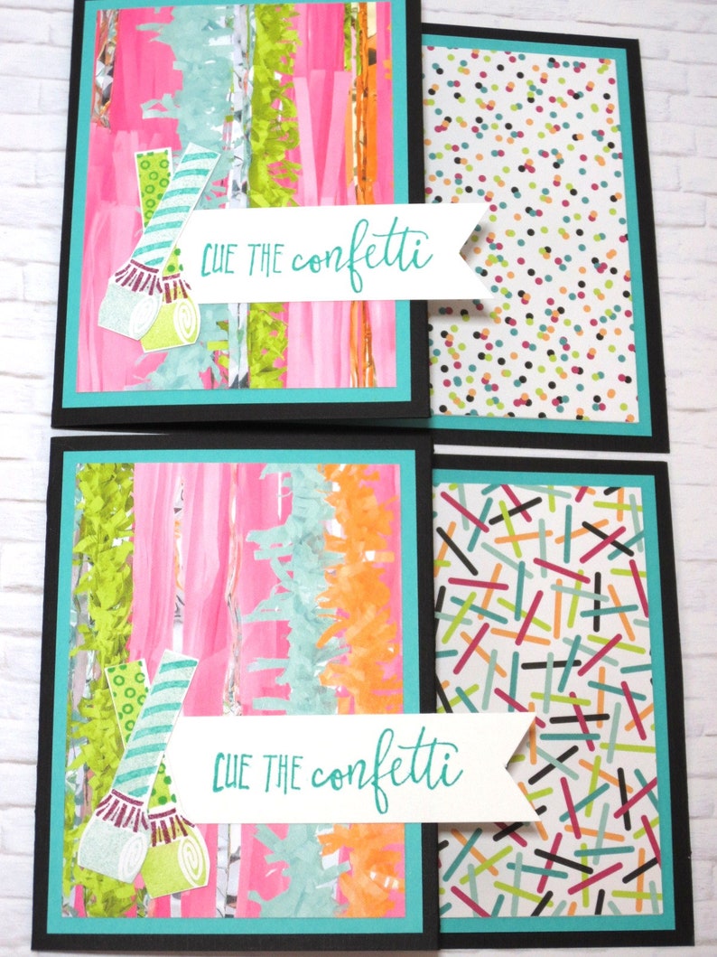 May include: Four handmade greeting cards with a party theme. Each card has a black border, a teal inner border, and a colorful design. The left side of the cards features pink, green, and orange streamers. The right side has a confetti pattern. The text "CUE THE confetti" is on a white banner.