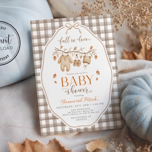 May include: A rectangular baby shower invitation card featuring a beige and white buffalo check border. The center displays a white label shape with a bow, autumn leaves, and baby clothes illustrations. Text includes fall in love, BABY SHOWER, and event details.
