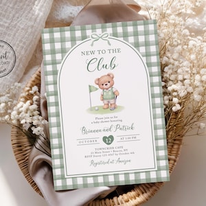 May include: A baby shower invitation card featuring a sage green and white gingham border, an arched frame, and a watercolor illustration of a teddy bear holding a golf club. The text reads New to the Club, Brianna and Patrick, October 12, and Towncrier Cafe.