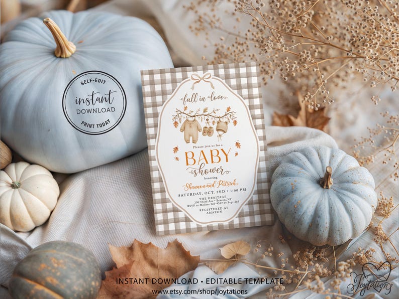 May include: A rectangular baby shower invitation card featuring a beige and white buffalo check border. The center displays a white label shape with a bow, autumn leaves, and baby clothes illustrations. Text includes fall in love, BABY SHOWER, and event details.