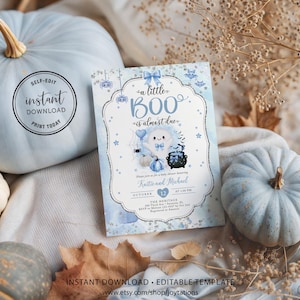 May include: A rectangular baby shower invitation card featuring a light blue and white watercolor background with a central ghost illustration, a black cauldron, and the text "a little BOO is almost due" in blue script and serif fonts.