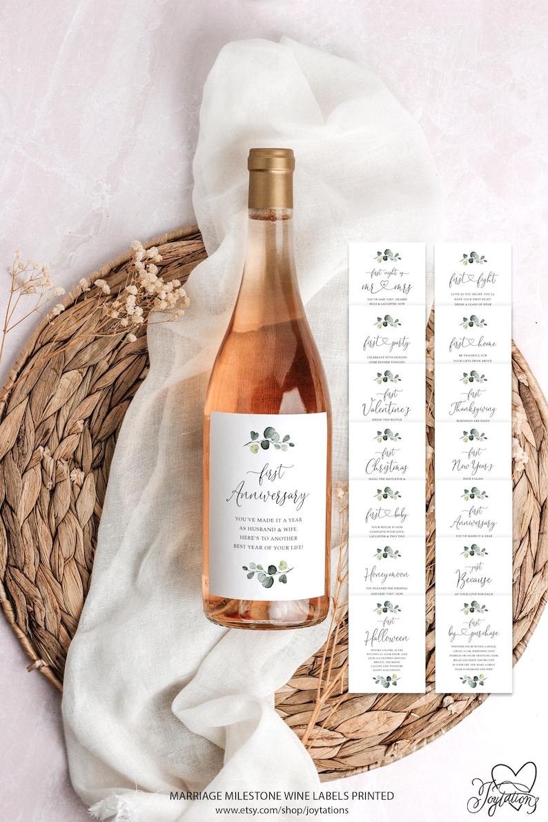 May include: A set of 12 printable wine bottle labels with a eucalyptus design. The labels feature different milestones for a couple, such as "First Anniversary", "First Night as Mr. & Mrs.", "First Home", "First Baby", and more. The labels are perfect for celebrating special occasions with a personalized touch.