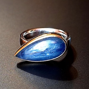 Silver ring with gold setting and kyanite