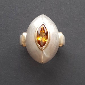 Handmade silver ring with 750 gold and citrine