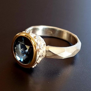 Silver ring with 585 gold and topaz