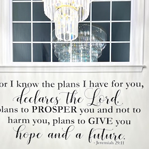 May include: A white wall decal with a scriptural quote from Jeremiah 29:11. The quote, in black script, reads "For I know the plans I have for you, declares the Lord, plans to PROSPER you and not to harm you, plans to GIVE you hope and a future."