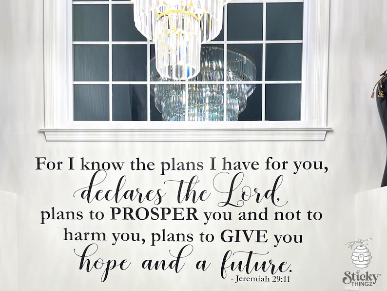 May include: A white wall decal with a scriptural quote from Jeremiah 29:11. The quote, in black script, reads "For I know the plans I have for you, declares the Lord, plans to PROSPER you and not to harm you, plans to GIVE you hope and a future."