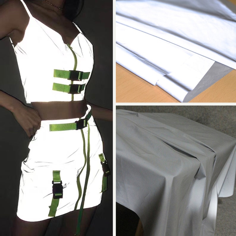 May include: A reflective silver crop top and skirt set with green straps and buckles. The fabric is shiny and has a reflective quality.