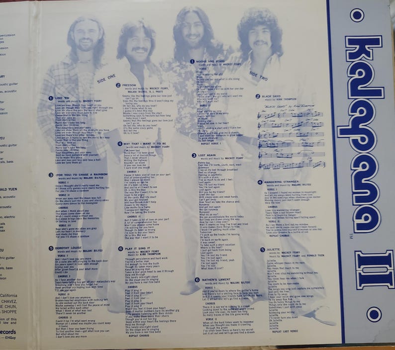 May include: An open vinyl record album with four men in a light blue and white design. The album cover has the text "Kalapana II" in blue. The album's interior includes song lyrics and the text "Side One" and "Side Two".
