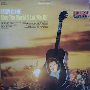 May include: A vintage vinyl record album cover featuring Patsy Cline. The cover art features a sunset background with a guitar and a portrait of Patsy Cline. The album title is "Stop The World & Let Me Off".