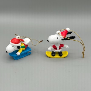 Vintage Snoopy Christmas Ornaments. Set of 2. Sledding Snoopy. Snowboarding Snoopy.