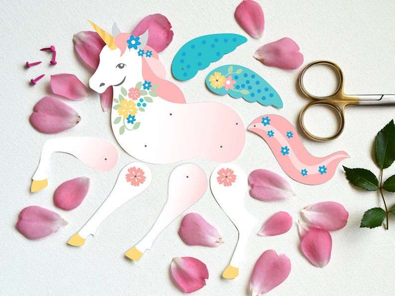 May include: A paper craft kit to make a unicorn with pink, white, and blue details. The kit includes a unicorn body, wings, and a tail. The unicorn has a flower crown and a horn.