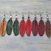 see more listings in the Leather feather earrings section