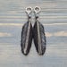 see more listings in the Leather feather earrings section