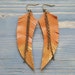see more listings in the Leather feather earrings section
