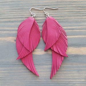 Fuchsia pink earrings. Pink leather earrings. Leather feather earrings. Long feather earrings. Bohemian earrings. Boho earrings. Boho chic. image 1