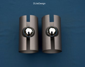 Pair of symmetrical sconces aluminum gray metallic.
