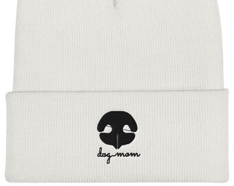 May include: White knitted beanie with a black dog nose silhouette and the text "dog mom" embroidered on the front.