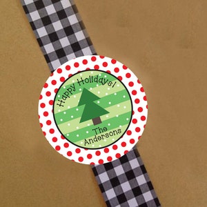 May include: Round red and white polka dot sticker with a green Christmas tree and the text "Happy Holidays! The Andersons".