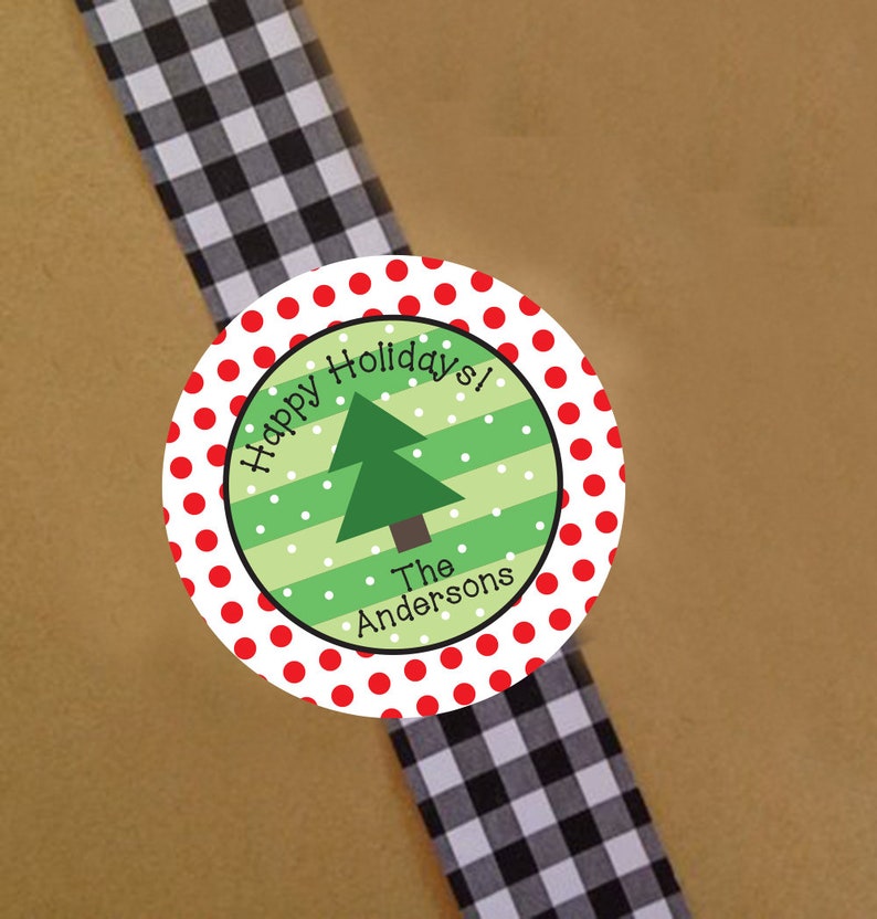 May include: Round red and white polka dot sticker with a green Christmas tree and the text "Happy Holidays! The Andersons".
