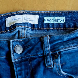 May include: Blue denim jeans with a Gap label and a white label that says "ISSAC WESTON".
