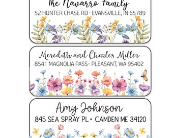 May include: Three floral return address labels with black borders. The top label reads "The Navarro Family 52 Hunter Chase Rd. Evansville, IN 65789". The middle label reads "Meredith and Charles Miller 8541 Magnolia Pass Pleasant, WA 95402". The bottom label reads "Amy Johnson 845 Sea Spray Pl. Camden ME 34120".