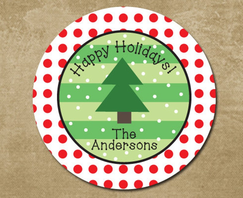 May include: Round red and white polka dot sticker with a green and white striped circle in the center. The inner circle has a green Christmas tree with the text "Happy Holidays!" above the tree and "The Andersons" below the tree.