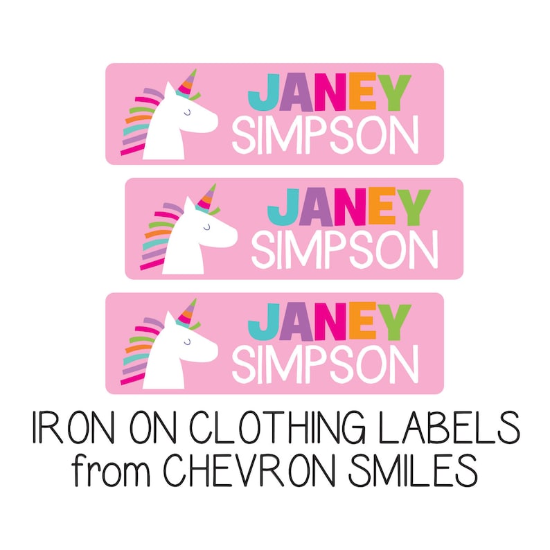 May include: Three pink iron-on clothing labels with a white unicorn and the name "JANEY SIMPSON" in colorful letters. The labels are for clothing and are from CHEVRON SMILES.