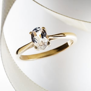 Gorgeous 1 carat, natural, 7x5 oval White Sapphire in a simple 14kt Yellow Gold ring.  Great Diamond Alternative!