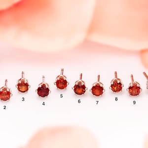 Natural Mozambique Garnet Earring Singles. Moderate orange red to dark red. Genuine gemstones in sterling silver. Photos of actual earrings.