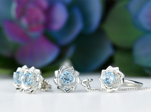 Sterling Silver Round Light Sky Blue Topaz & Diamond Lotus Flower Leverback Earrings Sterling Silver Round Light Sky Blue Topaz & Diamond Lotus Flower Leverback Earrings