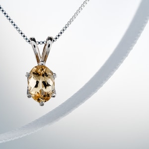 Authentic precious topaz pendant necklace. Ouro Preto, Brazil origin. 6x4mm oval Imperial Topaz. Sterling silver pendant, chain, case, box.