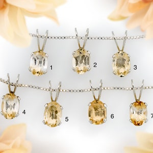 Oval Brazilian Imperial Topaz pendants. 6x4mm gemstones set in sterling silver. Chains sold separately to complete necklace.