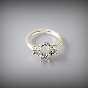 Premium Sterling Silver, 12x6mm Marquise Trellis style Ring Mount with round 3.5mm accents. Oxygen-free cast. Polished, ready for gemstone.