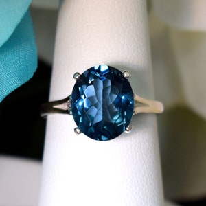 Fine Grade London Blue Topaz Ring.  Beautiful Blue Color!  Genuine Brazilian Gemstone!  11x9, Oval, 4+ ctw.  Great investment!  Select size.