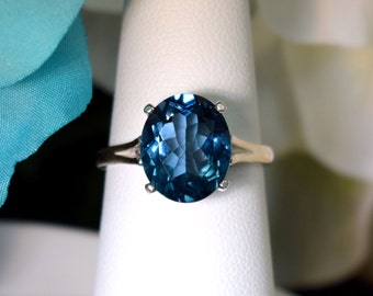 Fine Grade London Blue Topaz Ring.  Beautiful Blue Color!  Genuine Brazilian Gemstone!  11x9, Oval, 4+ ctw.  Great investment!  Select size.