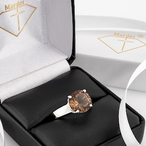 Brazilian Smoky Quartz Ring from our Cavern Collection. 10mm round, concave cut, rich brown. Cut to perfection, Grade AAA. Premium Silver.