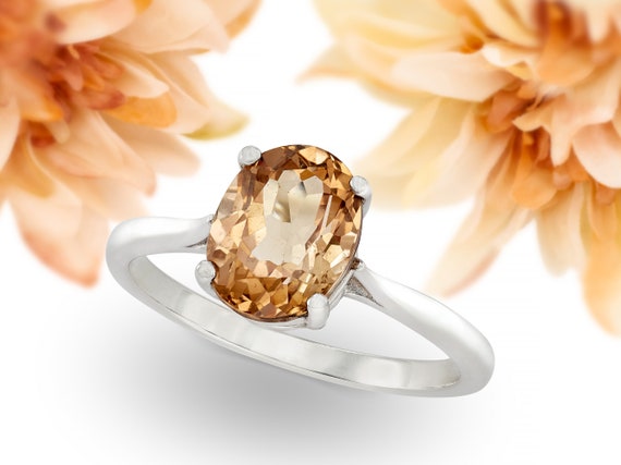 Sparkling 9x7mm Oval Faceted Brazilian Imperial Topaz Ring