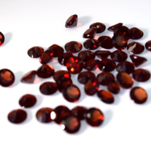 Natural, Mozambique, Almandine Garnet Gemstone.  Moderate to Dark Red Color. 5mm, round, faceted.  Grade AAA, .58ctw ea (avg). Price for ea.