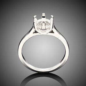 May include: A silver ring with a prong setting for a large gemstone. The ring is smooth and polished.