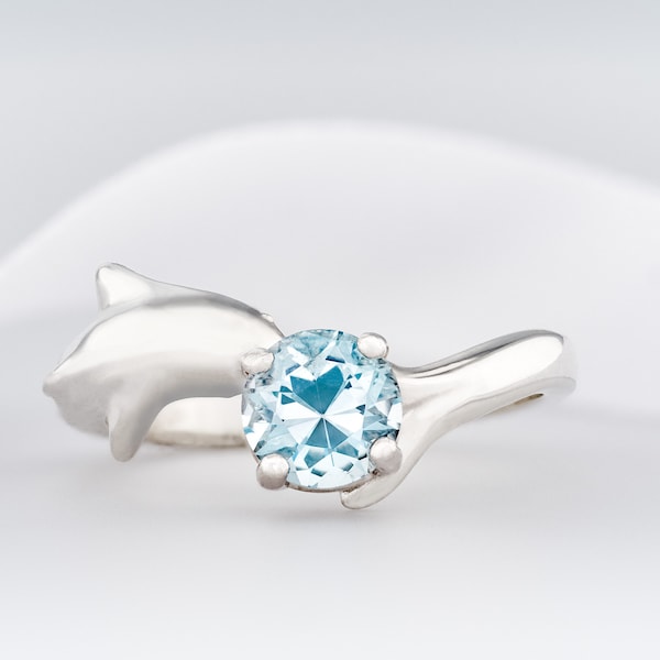 Blue topaz Dolphin ring. Natural, 6mm sky blue Topaz gemstone set in handmade premium silver ring in your selected size. Case and gift box.