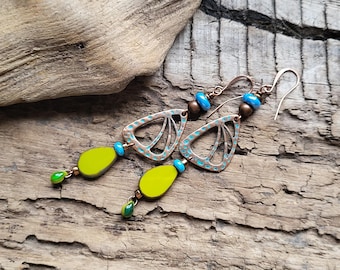 May include: A pair of dangle earrings with copper-toned metal butterfly charms, green and blue glass beads, and copper-toned hooks.