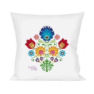 May include: White pillow with a colorful embroidered floral design. The flowers are red, yellow, blue, and green. The pillow has the text "Igielka MB" in purple.