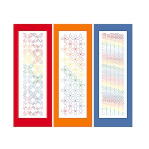 May include: Three vertical panels featuring different geometric designs. The left panel is red with a repeating pattern of blue, green, yellow, and orange squares. The centre panel is orange with a repeating pattern of blue, green, yellow, and orange flowers. The right panel is blue with a repeating pattern of blue, green, yellow, and orange lines.